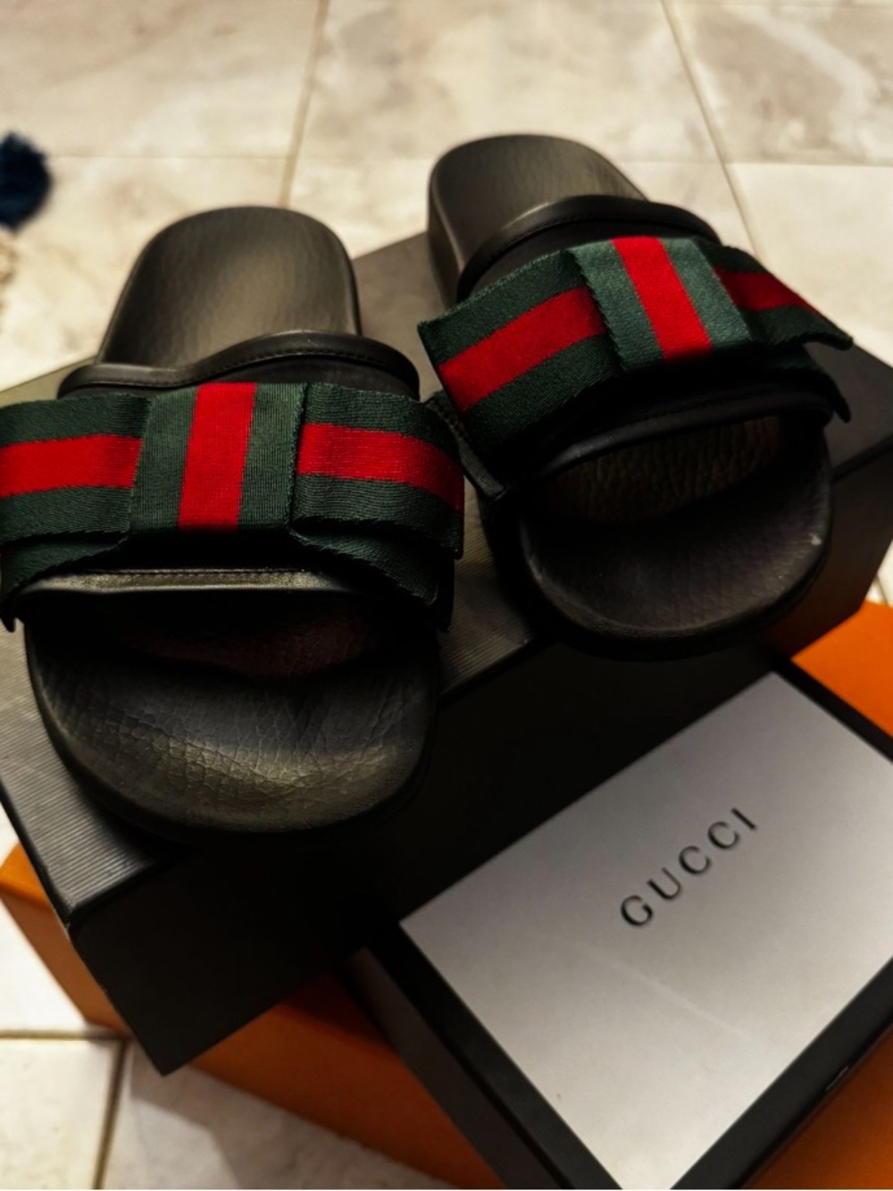 Footwear identified as slides/sandals